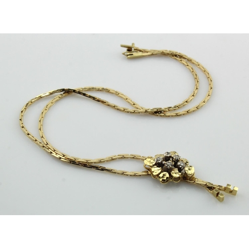 404 - Yellow gold (tests 14ct) diamond lariat necklace, integral pendant set with five diamonds,  pendant ... 