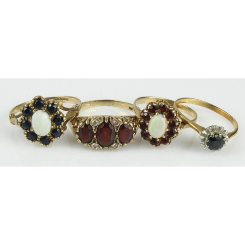 411 - Four 9ct gold/tests 9ct dress rings, stones include sapphire, opal, garnet and CZ, finger sizes N/O,... 