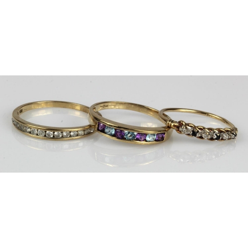 443 - Three 9ct gold half eternity rings, stones include diamond, sapphire, amethyst and topaz, finger siz... 