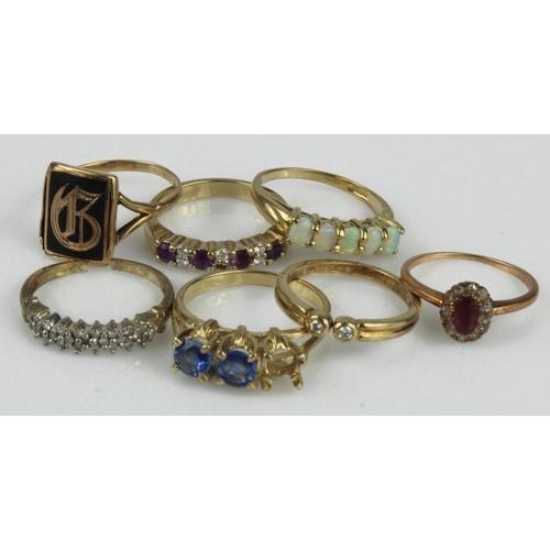 444 - Seven 9ct gold/tests 9ct rings, stones include diamond, ruby, opal, amethyst, kyanite, finger sizes ... 