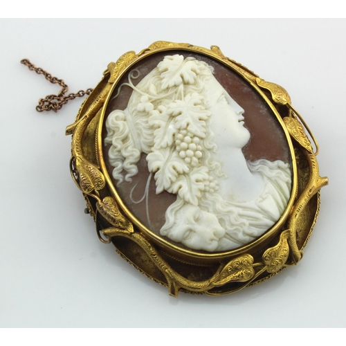 448 - Yellow gold (tests 18ct) Victorian carved cameo brooch depicting a female bacchante wearing a lion p... 