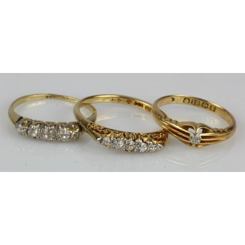 450 - Three 18ct gold/tests 18ct diamond rings, to include a Edwardian solitaire, TDW approx. 0.05ct, fing... 