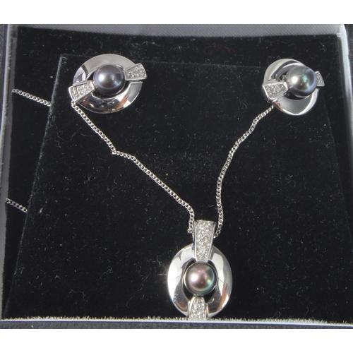 451 - 9ct white gold diamond and black pearl necklet and earring set, pendant set with one pearl and highl... 