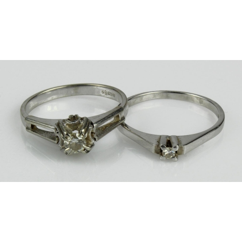 466 - Two 18ct white gold diamond solitaire rings, finger sizes N and O, total weight 5.5g.