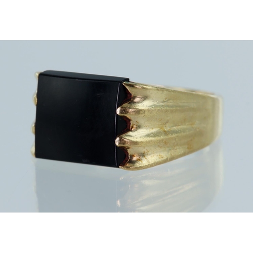 48 - Yellow gold (tests 9ct) onyx signet ring, onyx measures 10mm x 11mm, finger size R, weight 11.5g.