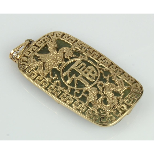 483 - 9ct yellow gold jade pendant, jadeite jade measures 37mm x 22mm, topped with a filigree Chinese styl... 