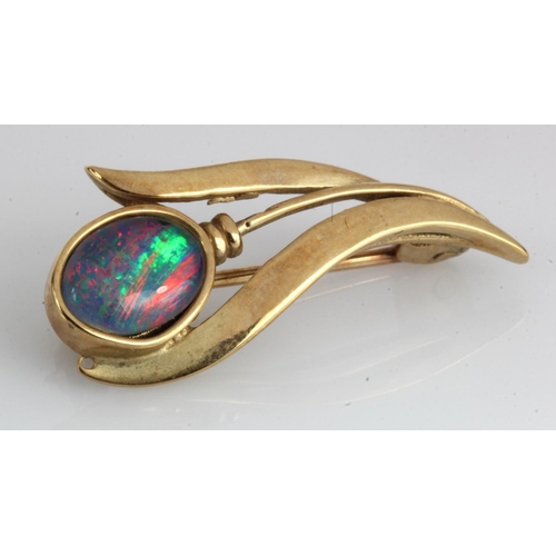 485 - Yellow gold (tests 9ct) Australian black opal triplet brooch, length 25mm, weight 2.3g.