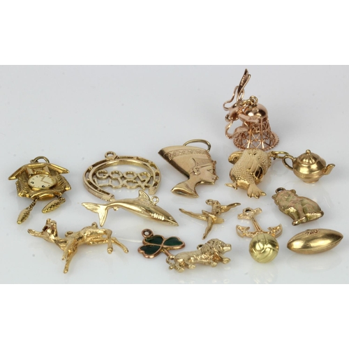 489 - Assortment of 9ct gold charms, total weight 23g.