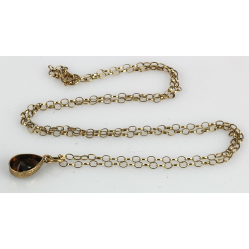 491 - 9ct yellow gold smokey quartz necklet, pear cut smokey quartz measures approx. 10mm x 7mm, bezel set... 