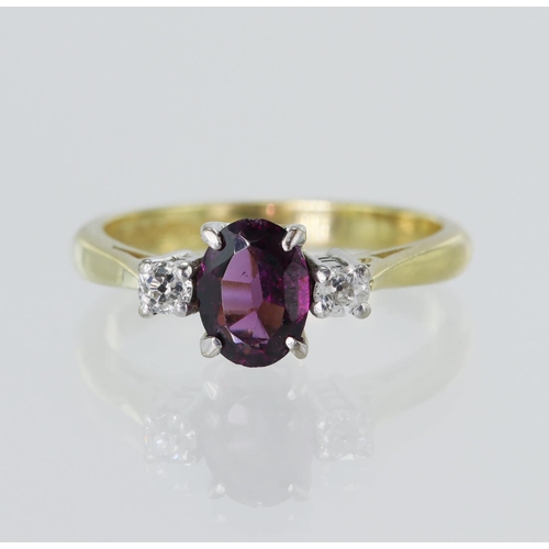 50 - 18ct yellow gold diamond and rhodolite garnet trilogy ring, oval rhodolite measures 6.6mm x 5mm, fla... 