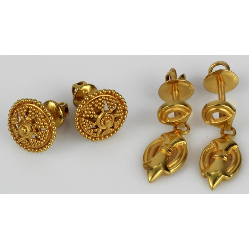 518 - Two pairs of yellow gold (tests 22ct) stud earrings, post and screw back fittings on both, total wei... 