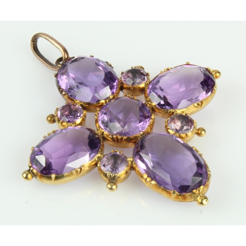 532 - Yellow gold (tests 9ct) antique amethyst cruciform pendant, set with nine oval and round cuts, lengt... 