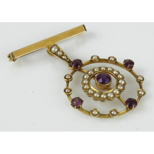 543 - Yellow gold (tests 15ct) Edwardian amethyst and seed pearl target pendant brooch, length 32mm, bail ... 