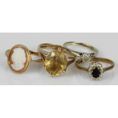 544 - Four 9ct gold rings, stones include diamond, sapphire, citrine, carved shell, finger sizes H, K/L, N... 