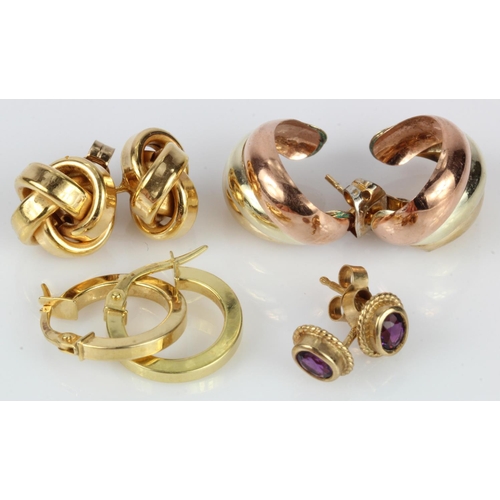 557 - Four pairs of 9ct earrings, tri-colour semi hoop studs, knot studs, huggies and amethyst studs, tota... 