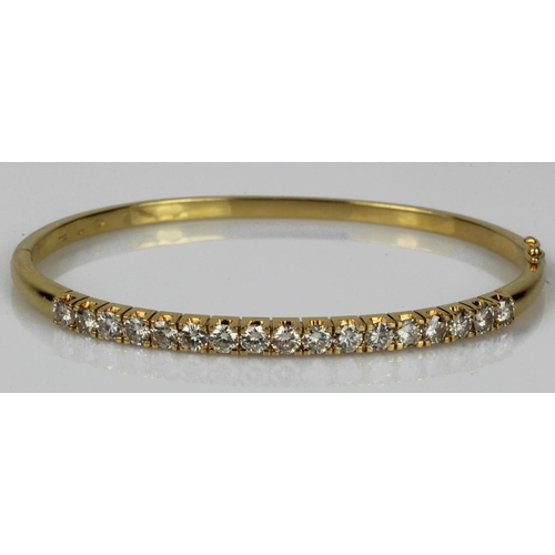 562 - Yellow gold (tests 18ct) diamond bangle, seventeen round brilliant cut diamonds, TDW approx. 2.38ct,... 