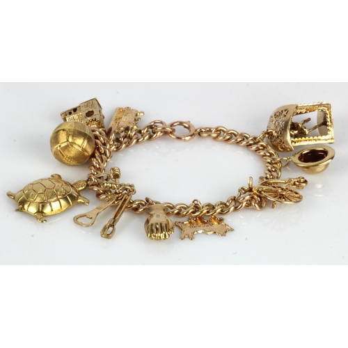 586 - 9ct yellow gold charm bracelet including ten 9ct gold charms, total weight 35.3g.