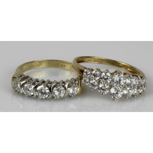 594 - Two 14ct gold/tests 14ct CZ rings, finger sizes N/O, total weight 6g.