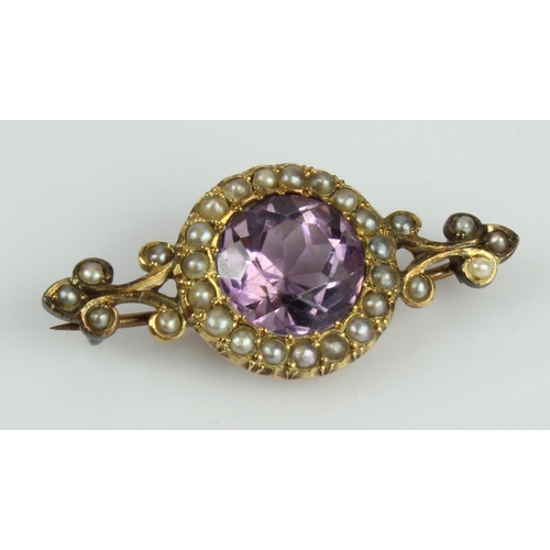 597 - Yellow gold (tests 9ct) antique amethyst and half pearl brooch, amethyst measures 10mm, length 38mm,... 