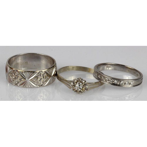 606 - Three 18ct white gold/tests 18ct rings, diamond solitaire TDW approx. 0.04ct, finger size N/O. Diamo... 