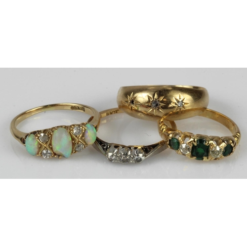 636 - Four 18ct gold/tests rings, stones include diamond, opal and paste, finger size K, L, N, N/O, all wi... 