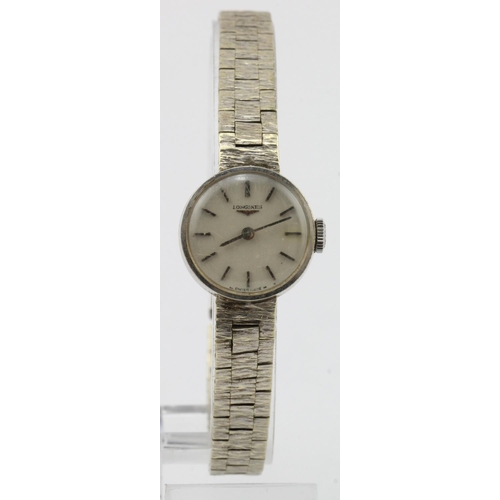 706 - Ladies 9ct cased white gold manual wind Longines wristwatch.  The signed 17mm dial with silver baton... 