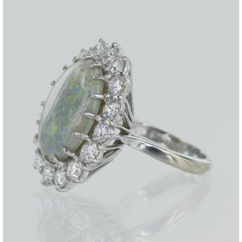 73 - 18ct white gold diamond and opal cocktail dress ring, oval cabochon opal measures 16.5mm x 12.9mm, s... 