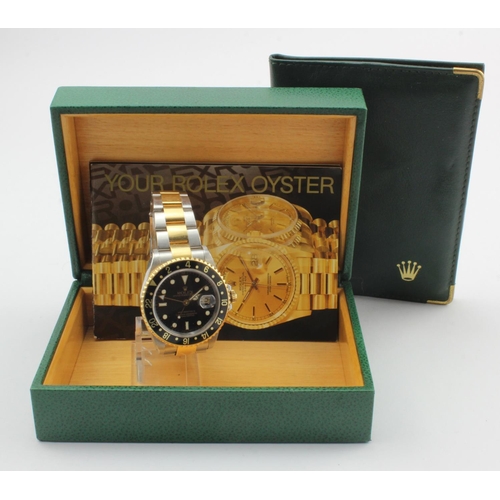 735 - Gents Stainless steel cased Rolex GMT - Master II, circa 2000, The black and gold dial with black an... 