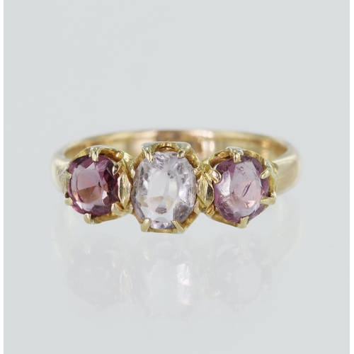 77 - Yellow gold (tests 18ct) antique trilogy ring, set with one rose quartz measuring approx. 6mm x 4mm,... 