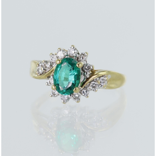 8 - Yellow gold (tests 18ct) diamond and synthetic emerald cluster ring, syn. emerald measures 7mm x 5mm... 