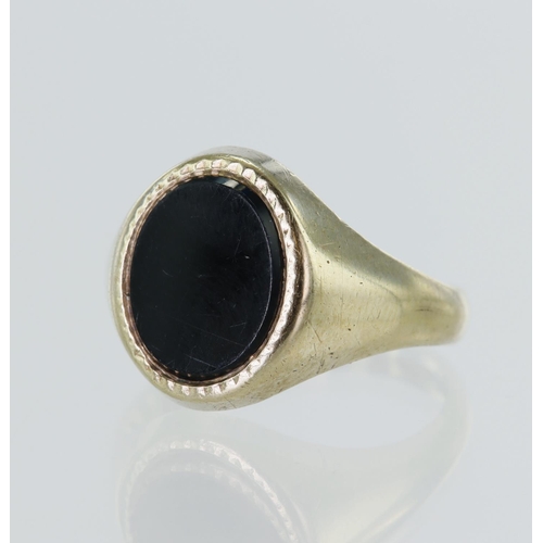 87 - 9ct yellow gold onyx signet ring, onyx measures approx. 11mm x 9mm, finger size S, weight 5.3g.