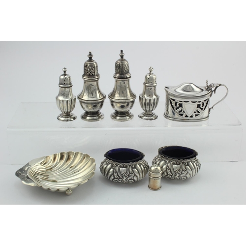 962 - Mixed lot of silver comprising five peppers, two salts and mustard pot (the salts and pot have blue ... 