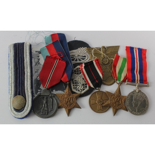 1119 - German 3rd Reich medals, cloth badges, eppulette, etc. And three Britis WW2 medals  (10 items)