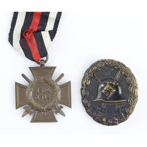 1164 - German Cross of Honour with wound badge in black both with award documents to Jakob Strobel.