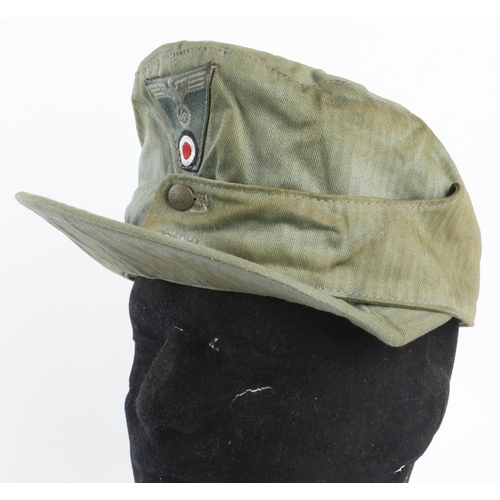 1178 - German Forage cap M43 in herringbone material, one button absent, service wear.