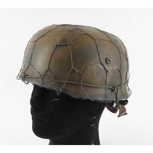 1219 - German Luftwaffe Paratroopers helmet with single decal complete with lining and chin strap.