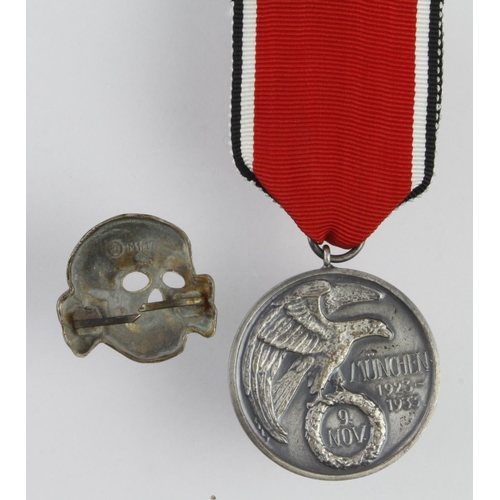 1231 - German NSDAP Blood Order 1923, stamped '800' and '677'. Skull badge maker marked 'RZM M1/17'.   (2)