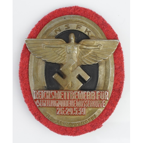 1243 - German NSKK Reichswettbewerbfur rally badge.