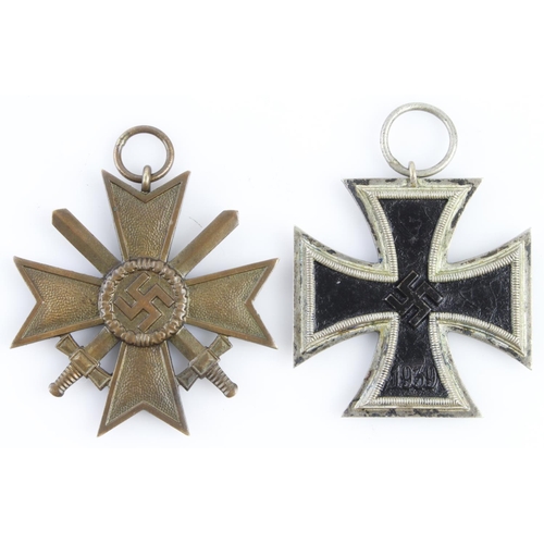 1325 - German WW2 Iron Cross 2nd Class maker marked '4' to ring, and a War Merit Cross with Swords.  (2)