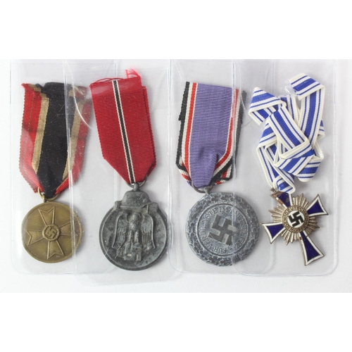 1329 - German WW2 medals including Mothers Cross in silver, Russian Front medal, Lufftscutz medal and War M... 