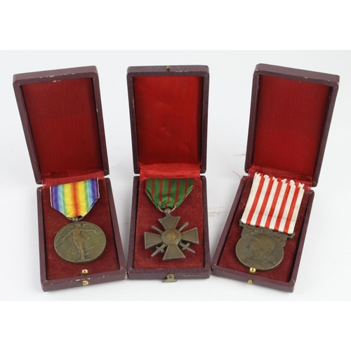 1599 - French WW1 group of three medals War medal, Victory medal and Croix de Guerre all in cases J Lerou.