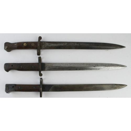 937 - Bayonets all without scabbards - 1903 dated British Enfield, Metford 1894 dated, and 1944 India Patt... 