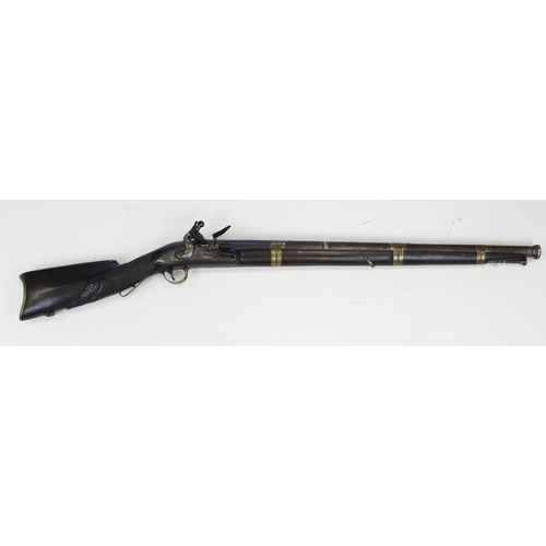 961 - Flintlock canon barrel musket of Far East origin with European lock carved stock and embossed barrel... 