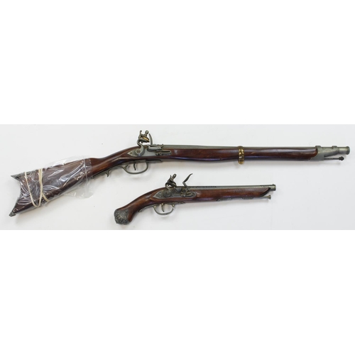 962 - Flintlock replica guns, Dragoon type pistol, woode stock and metal construction, lock in w/order. Fl... 