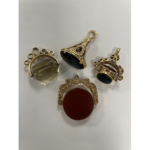 652 - Four 9ct yellow gold fob pendants, stones include citrine, cornelian, bloodstone and onyx, total wei... 