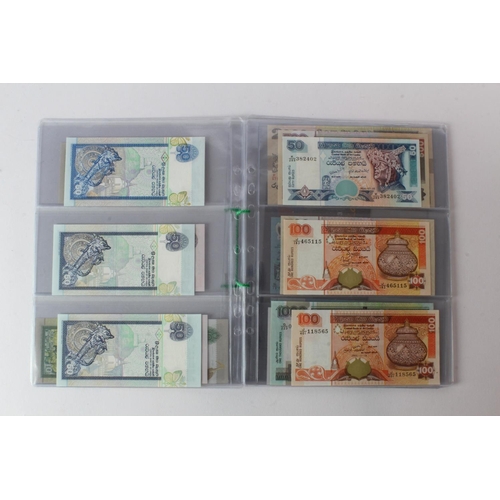 429 - Sri Lanka (28), an Uncirculated group in album pages, 10 Rupees, 20 Rupees, 50 Rupees, 100 Rupees, 2... 