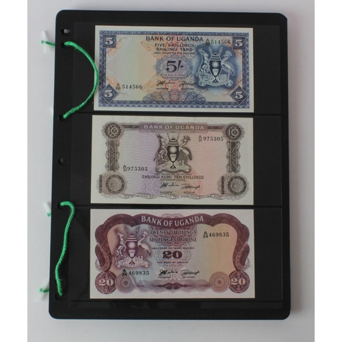 438 - Uganda (42), an Uncirculated group in album pages, 5 Shillings, 10 Shillings, 20 Shillings, 50 Shill... 