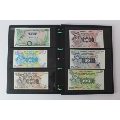 438 - Uganda (42), an Uncirculated group in album pages, 5 Shillings, 10 Shillings, 20 Shillings, 50 Shill... 