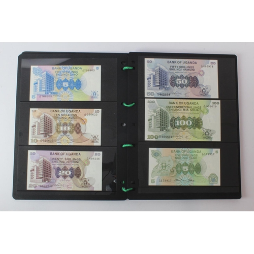 438 - Uganda (42), an Uncirculated group in album pages, 5 Shillings, 10 Shillings, 20 Shillings, 50 Shill... 