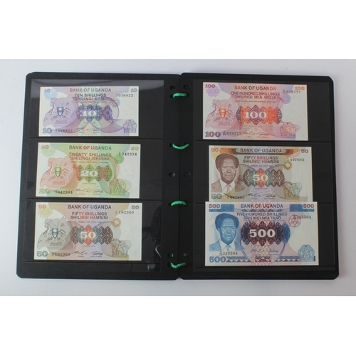438 - Uganda (42), an Uncirculated group in album pages, 5 Shillings, 10 Shillings, 20 Shillings, 50 Shill... 